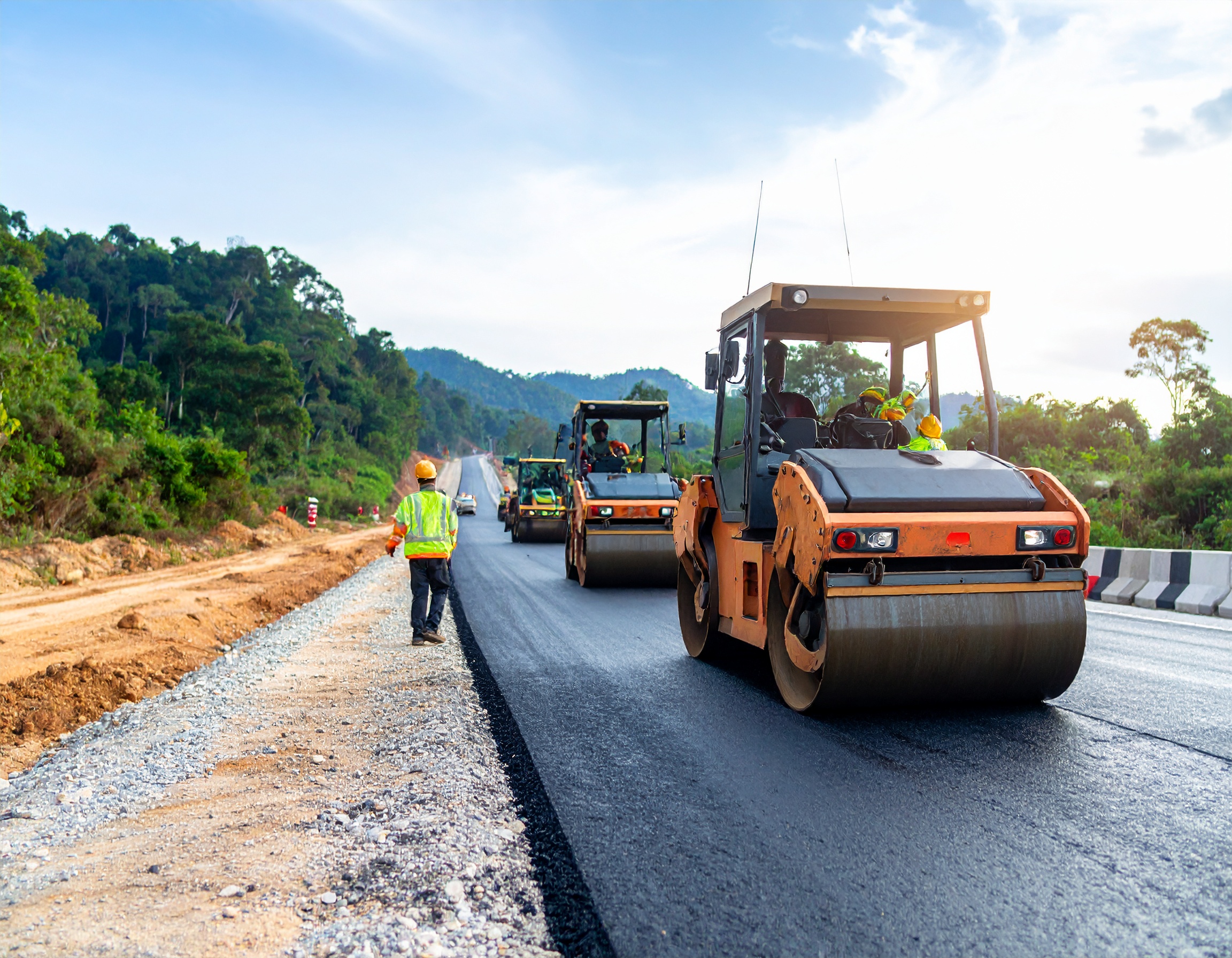 Roadwork professionals working on a road construction project